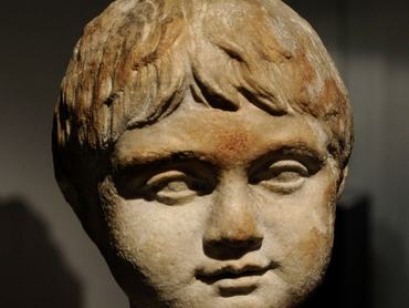 Bust of a boy about three years old. Roman funerary monument. 1st century AD. Marble. Roman-Germanic Museum. Cologne, Germany. (Photo by: Universal History Archive/ Universal Images Group via Getty Images)