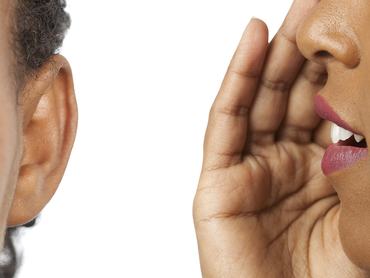 Women whispering and listening to gossip isolated on a white background.